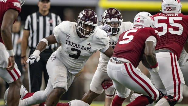 Sep 30, 2023; Arlington, Texas, USA; Texas A&M Aggies defensive lineman McKinnley Jackson (3) and Arkansas Razorbacks running back Raheim Sanders (5) in action during the game between the Texas A&M Aggies and the Arkansas Razorbacks at AT&T Stadium. Mandatory Credit: Jerome Miron-USA TODAY Sports  